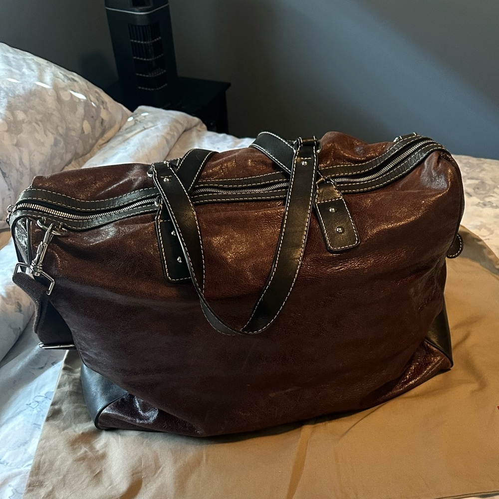 Gorgeous Distressed Leather Duffel Bag with dust bag.